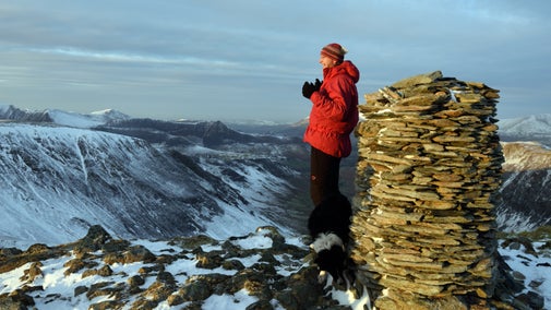 Visitors at the peak of Dale head, looking out over Newlands Valley. Borrowdale and Derwent Water, Cumbria.